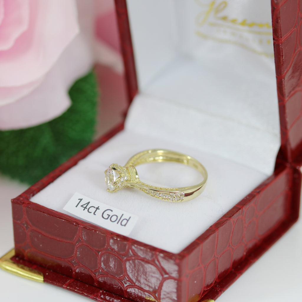 Close-up of the Queen’s Crown style 14ct gold CZ ring lying on a white cushion labelled “14ct Gold”.