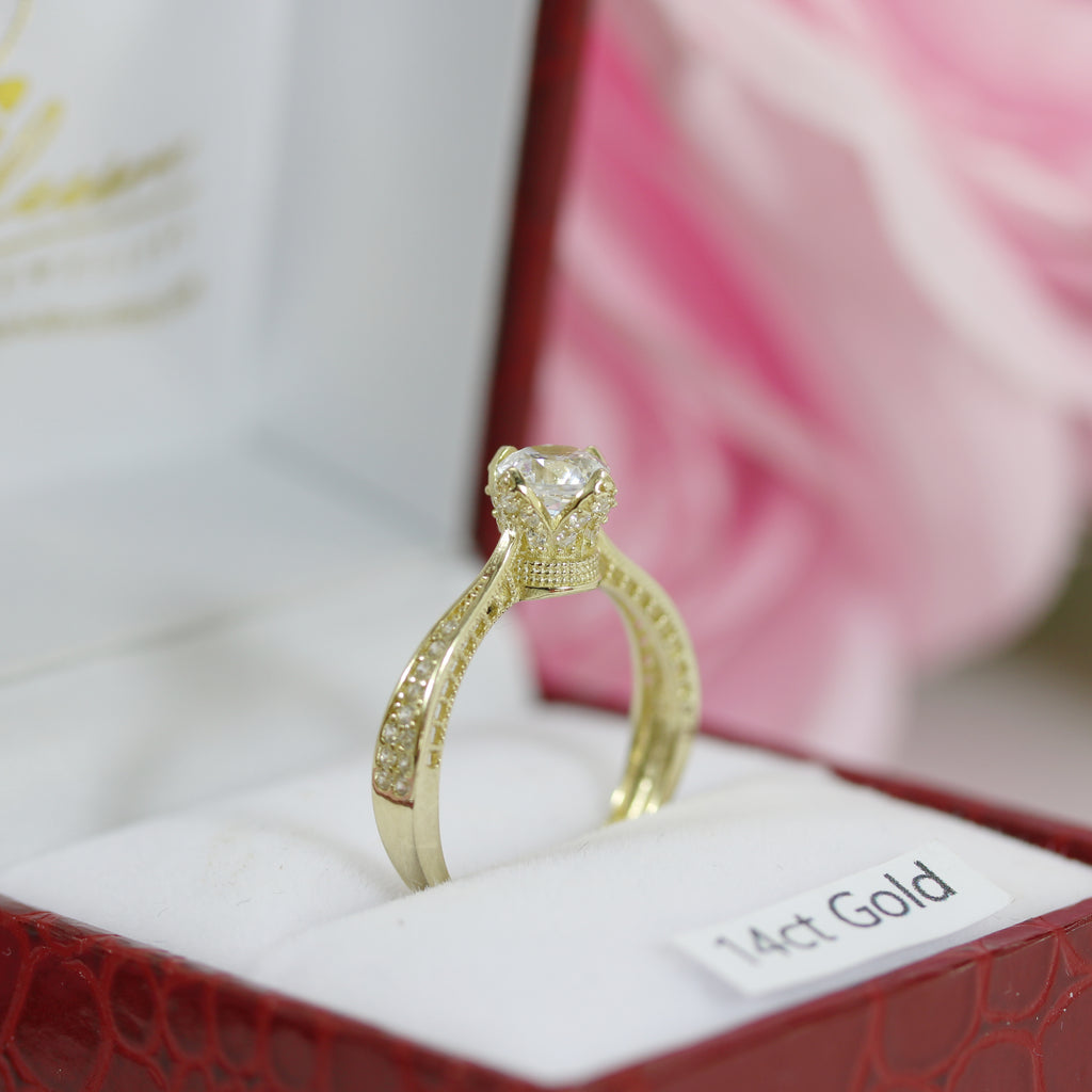 Macro shot of the crown-inspired 14ct gold CZ ring showing detailed band engravings within a Gleeson Jewellers box.