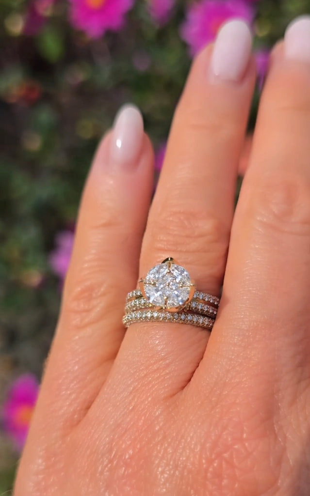 Elegant hand shot of Gleeson Jewellers’ Clíona ring set, three pavé-set bands with natural diamonds surrounding a crown cluster.