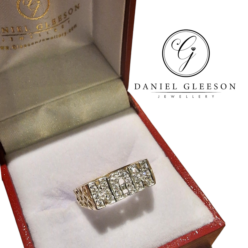 Unveil the elegance of the 9ct Gold nan ring from Daniel Gleeson Jewellers Cork, nestled in a luxurious red jewelry gift ring box. Adorned with sparkling cubic zirconia, this ring is a timeless symbol of grandmotherly love and grace. Discover the perfect gift for your loved one at Daniel Gleeson Jewellers Cork