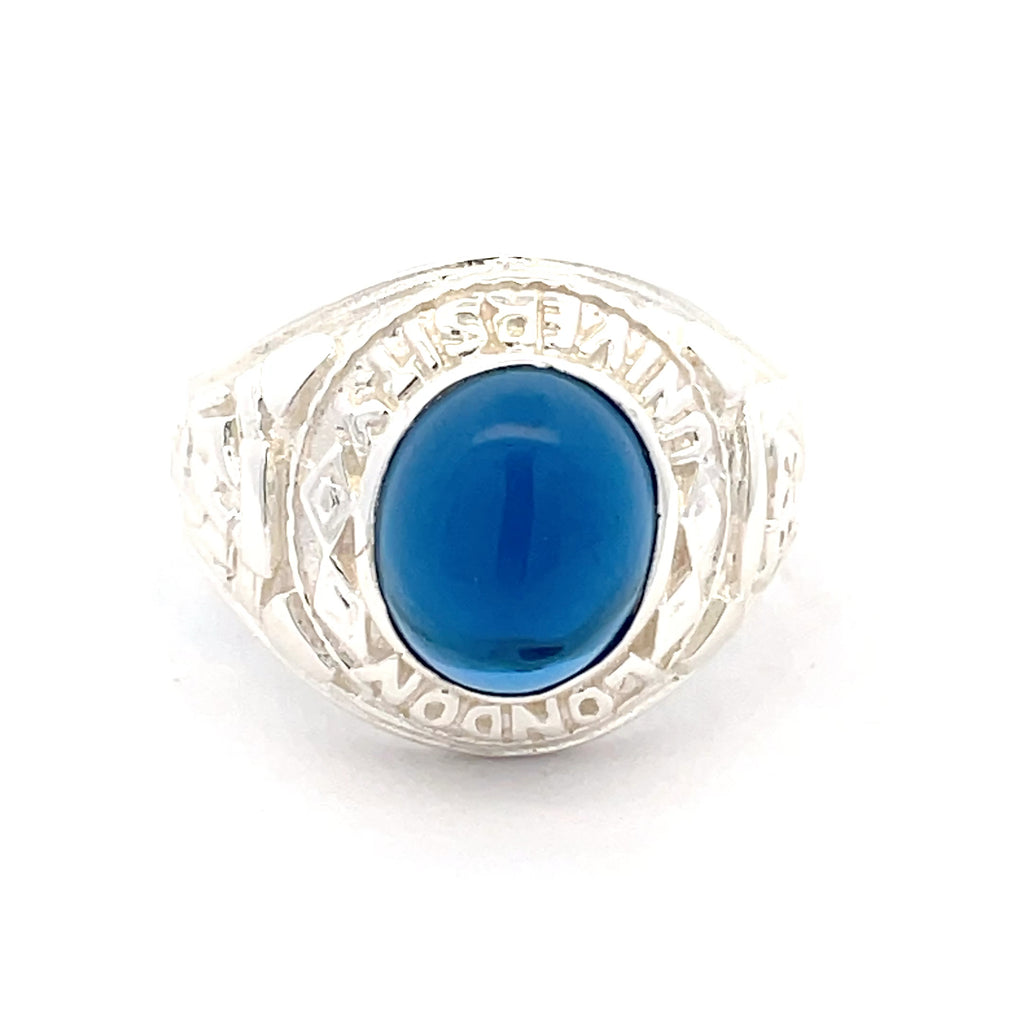 Mans Silver college ring with a blue stone on a white background