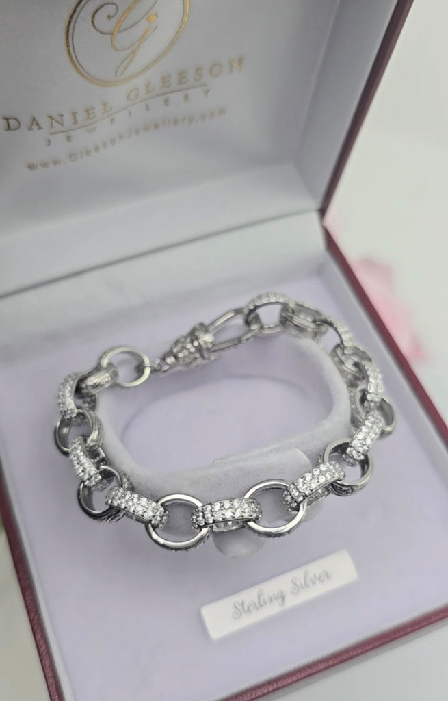 Sterling silver patterned oval link bracelet arranged in a circle inside a Gleeson Jewellers Cork presentation box