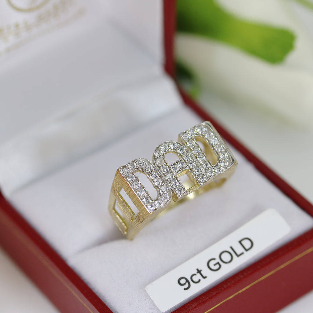 DAD Ring inside an open jewelry box with a 9ct GOLD label – A clear product shot displaying the ring’s luxurious gold tone, sparkling stones, and intricate craftsmanship.