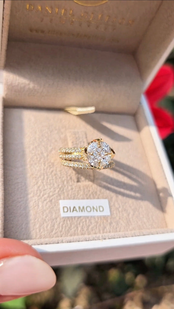 Gleeson Jewellers’ Clíona engagement and wedding ring set, yellow gold and natural diamonds, shown against pink floral background.