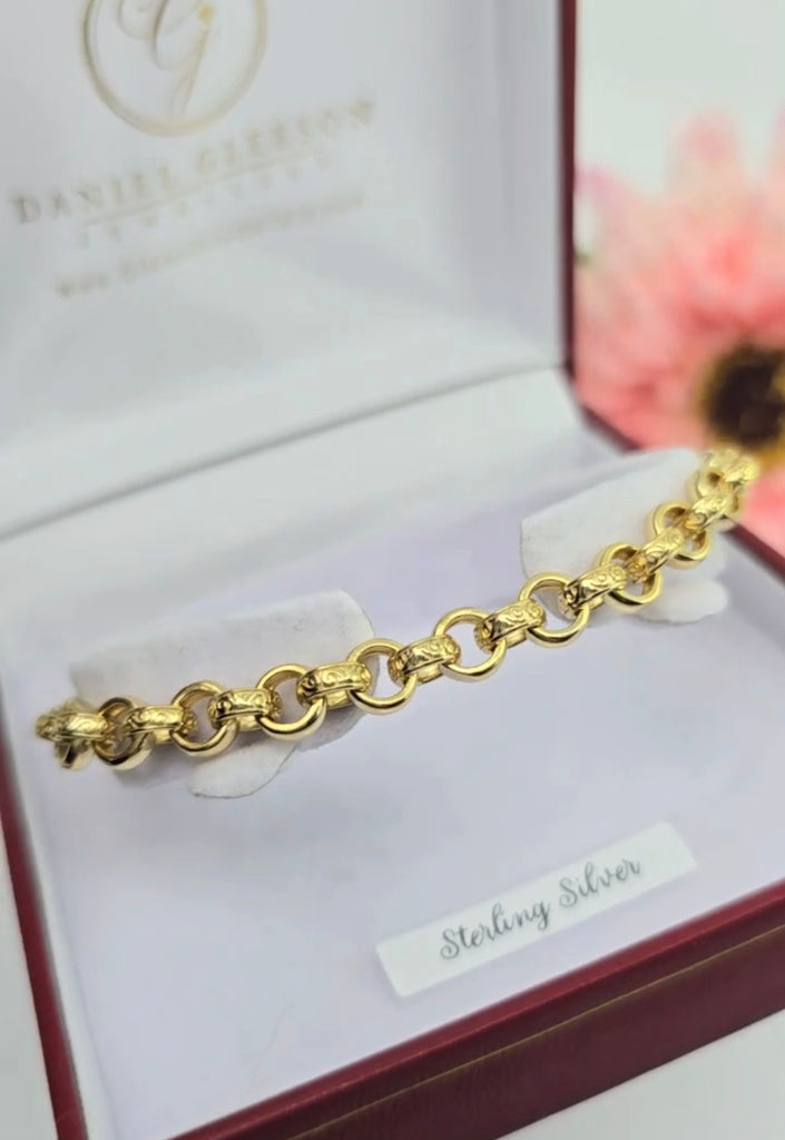 Gold-plated sterling silver 6mm belcher link bracelet with pink cubic zirconia, displayed in a Gleeson Jewellers Cork presentation box.