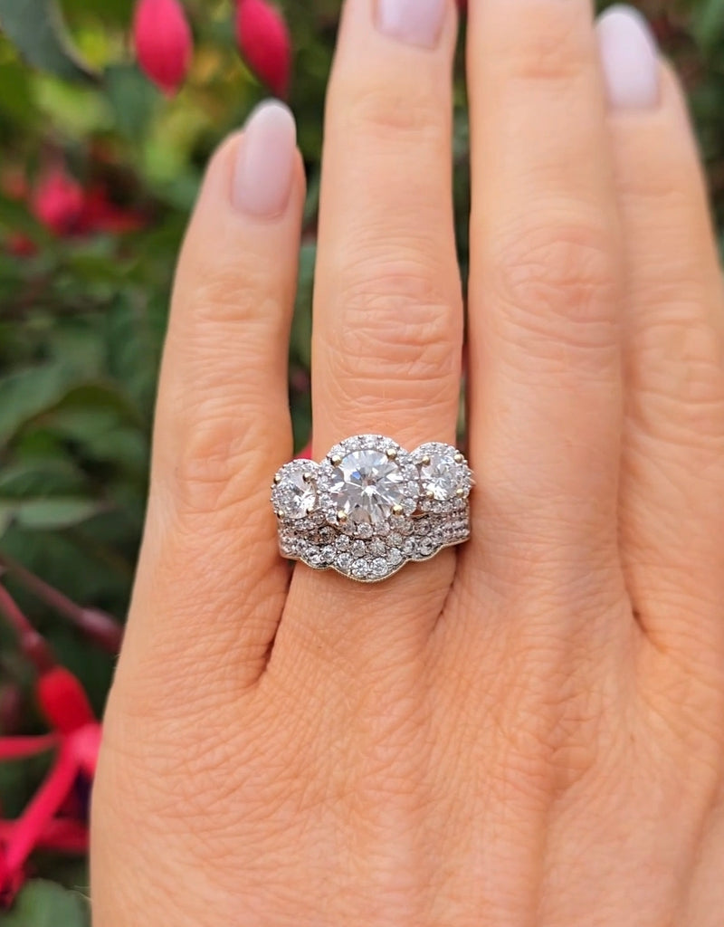Engagement ring set with a large diamond on a hand against a blurred natural background in gleeson jewellers 