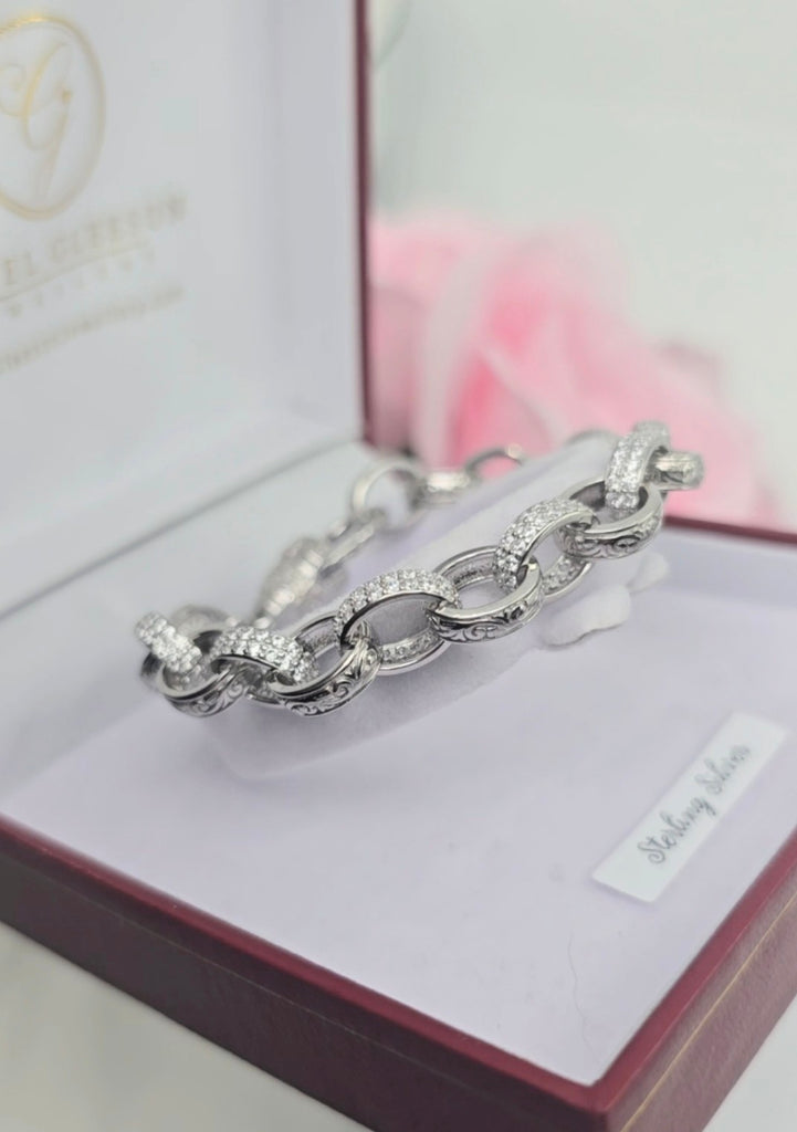 Side view of a sterling silver oval CZ link bracelet presented in an open Gleeson Jewellers in Cork box