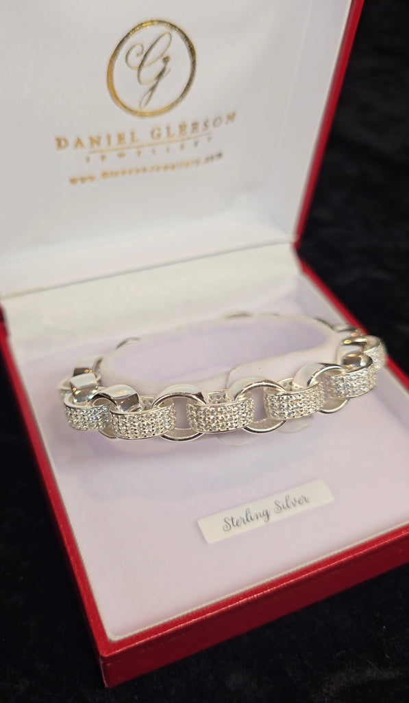 Another angle of the bracelet from Daniel Gleeson Jewellers in its jewellery box, emphasizing the rhodium-plated finish and the alternating CZ accents, with the box's lid slightly open to reveal the beautiful piece inside.