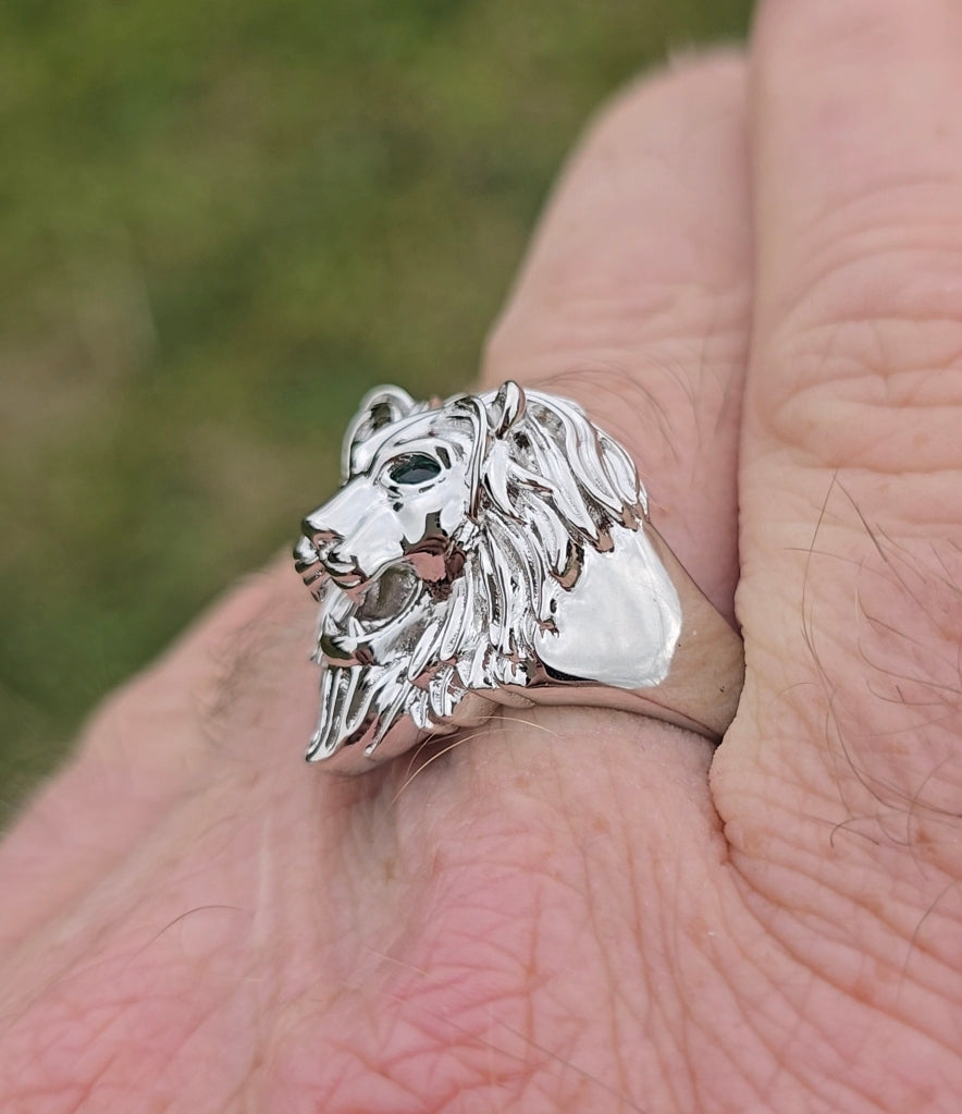 Side profile of sterling silver lion ring, highlighting mane detail and band design.
