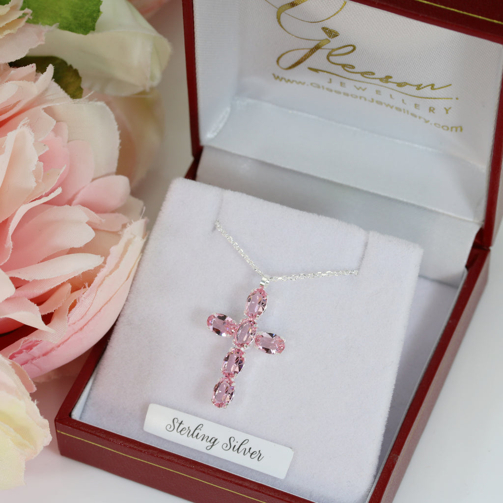 sterling silver cross and chain with pink stones, presented in a jewellery box from gleeson jewellery in Cork 