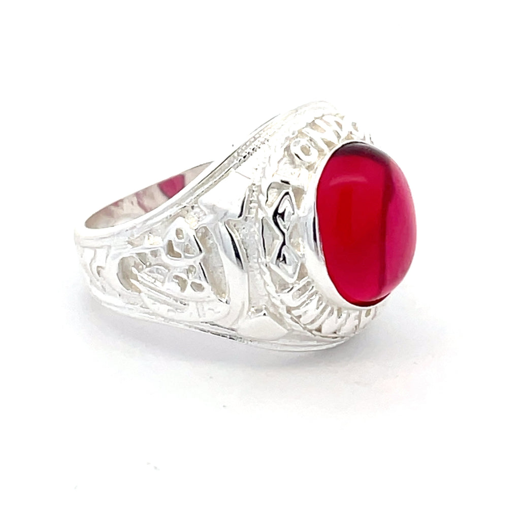 Side view of sterling silver men’s college ring with deep red oval stone, available at Gleeson Jewellers.