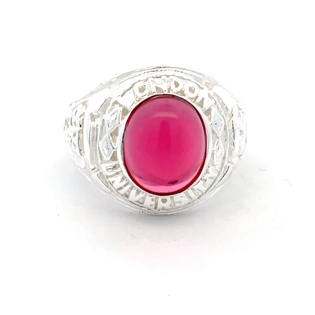 Front view of men’s sterling silver college ring with oval red stone centrepiece.