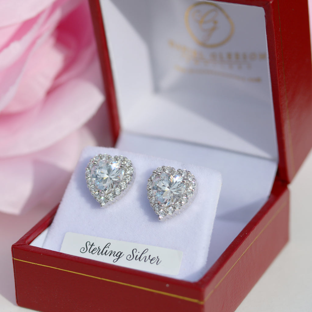 Elegant heart-shaped cubic zirconia stud earrings in sterling silver, presented in a Gleeson Jewellery box. Available online for purchase