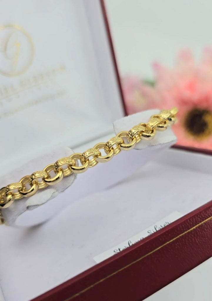 Side angle photo of a gold-plated sterling silver belcher bracelet with pink CZ stones inside a Gleeson Jewellers jewellery box