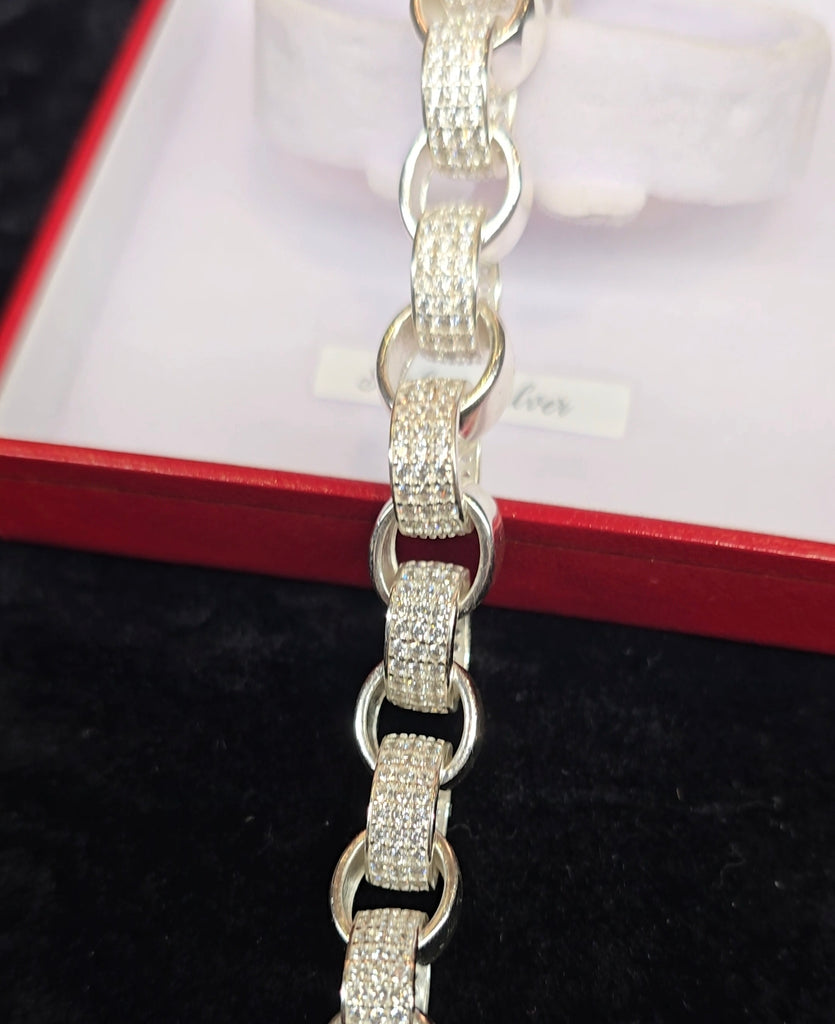 Another angle of the bracelet from Daniel Gleeson Jewellers in its jewellery box, emphasizing the rhodium-plated finish and the alternating CZ accents, with the box's lid slightly open to reveal the beautiful piece inside.
