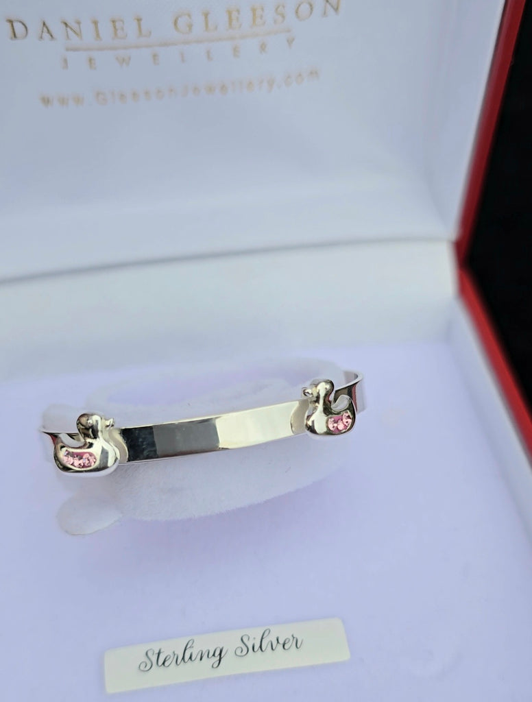 Baby bangle with pink cz ducks on. Complimentary Engraving 