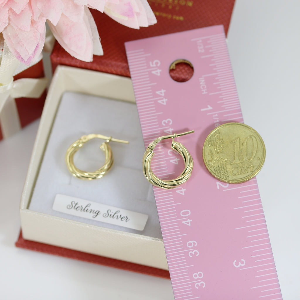 Gold vermeil twisted sterling silver hoop earrings beside pink ruler and 10 cent coin for size reference – Gleeson Jewellers, Cork