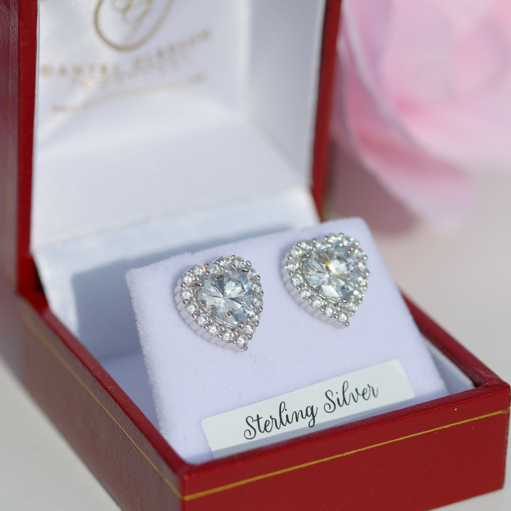 Sterling Silver Heart-Shaped CZ Halo Stud Earrings from Gleeson Jewellery, displayed in a luxurious red and white gift box. Available online