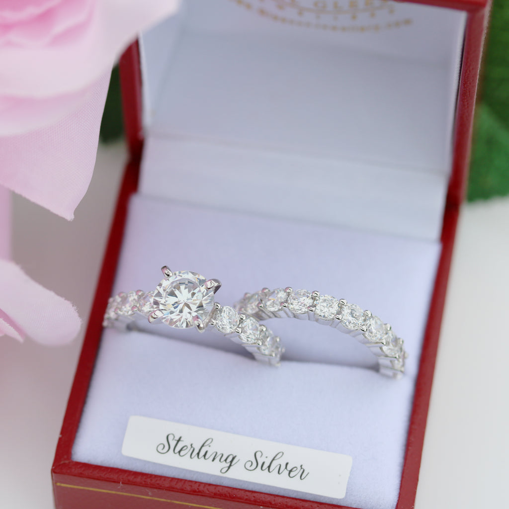 Sterling silver Helena engagement ring with matching wedding band in luxury red jewellery box.