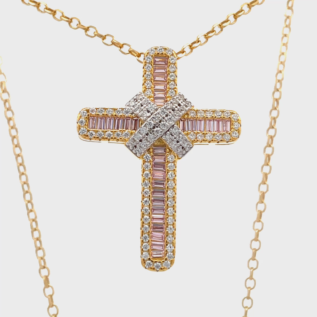 Overhead view of 18ct gold plated sterling silver pink cubic zirconia kiss cross necklace.