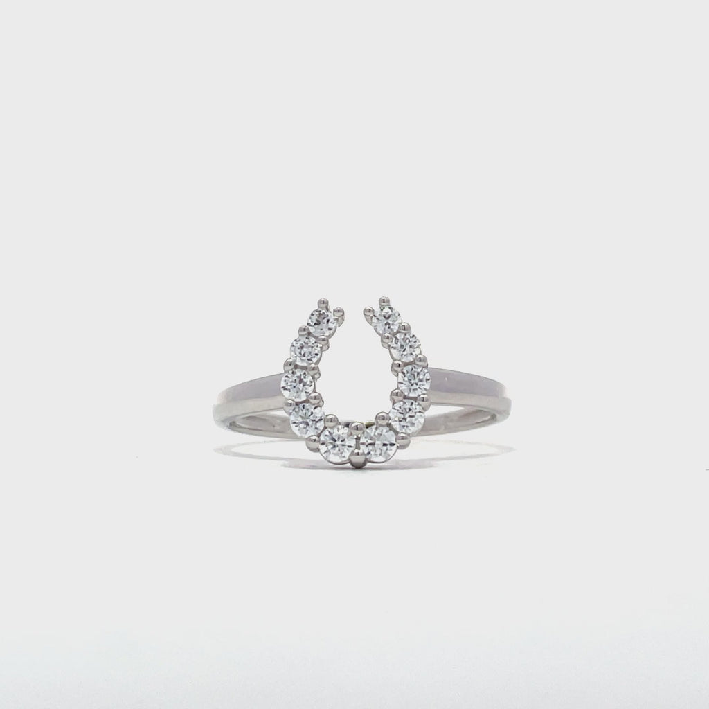 9ct white gold horseshoe dress ring showing stone set design